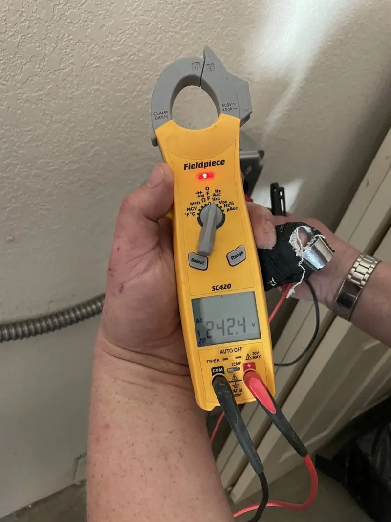 Voltage testing with clamp meter during Electrical Installation Services in Polk